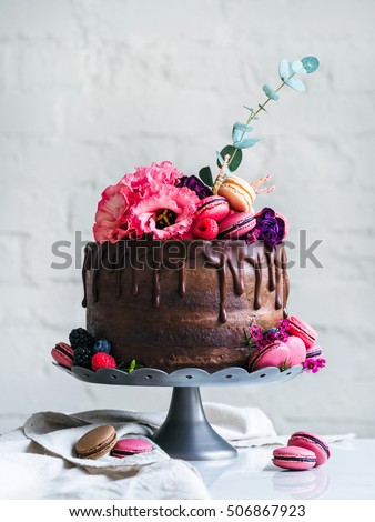 Wedding cake with flowers macarons and blueberries