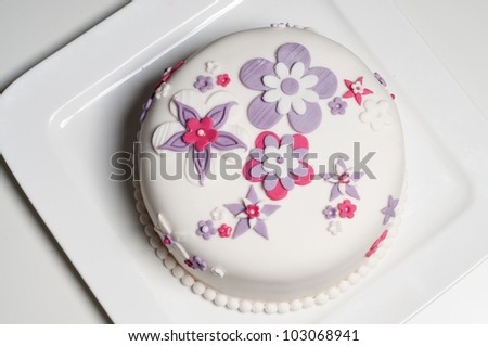 Wedding cake with pink and lilac flowers