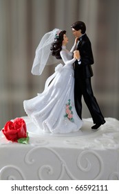 Wedding Cake And Topper With Couple Dancing