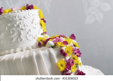 Wedding cake withe with flowers pink and yellow