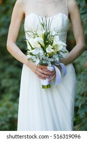 Wedding Calla Lilies Bouquet In Bride's Hands