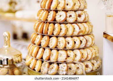 Wedding candy bar table. pyramid of Cakes with cream and berries and other sweets. High quality photo.