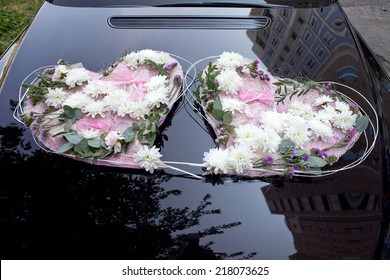 Wedding Car Decorated with Flowers in the form of two hearts.