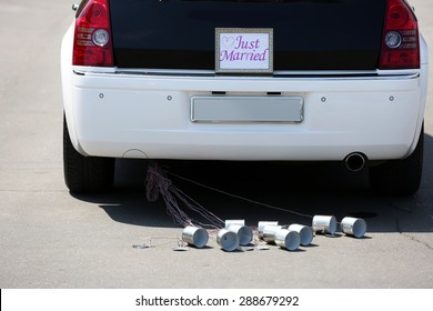 Wedding Car With Just Married Sign And Cans