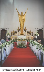 Wedding Ceremony In The Church. Empty Altar And Selective Focus On The Jesus Christ. Vintage Filmed Grained Filter Applied