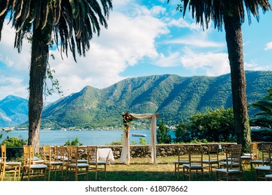 Wedding ceremony at a church Orthodox Church of the Nativity of the Virgin in Perast between the palm trees in Montenegro