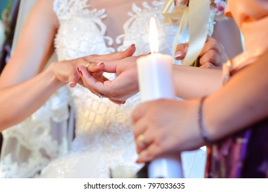 Wedding ceremony hands detail with ring on finger - Shutterstock ID 797033635