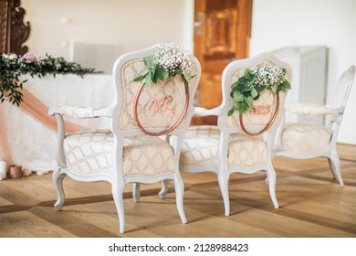 Wedding Ceremony Setup Chairs With Mr And Mrs Sign, Decorated With White Flowers, Luxury Indoor Venue With Natural Light