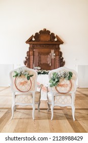 Wedding Ceremony Setup Chairs With Mr And Mrs Sign, Decorated With White Flowers, Luxury Indoor Venue With Natural Light