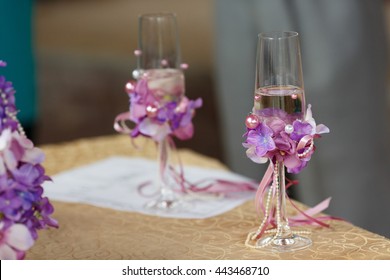 Wedding Champagne  Flutes Decorated With Pearls And Violet Flowers