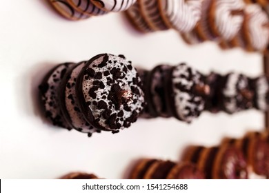 Wedding Chocolate Donuts For Guests. Festive Concept. Sweets On A Wedding Day. Wedding Donuts. A Yummy Donut Wall.