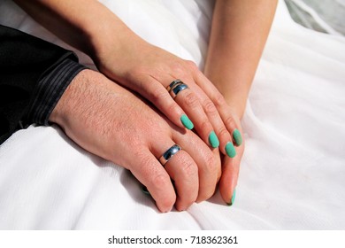 Wedding concept. Wedding couple hands with a wedding rings. Happy couple day wedding. Beautiful bride and groom. Cheerful married couple. - Shutterstock ID 718362361