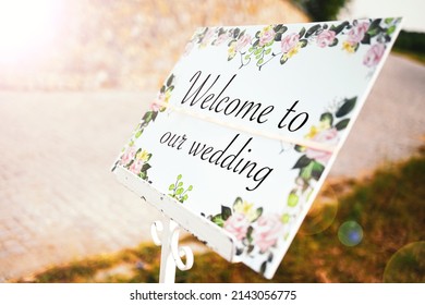 Wedding Concept Photo. Welcome To Our Wedding Message On A Floral Board At The Entrance Of The Event Ceremony Venue.