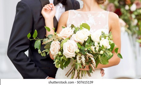 Wedding Couple With Bride Holding Bouquet