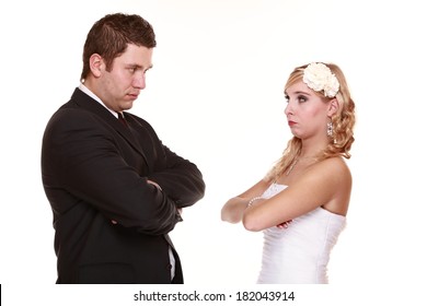 Wedding couple conflict, bad relationships. Woman bride and man groom looking at each other with angry expression. Isolated on white
