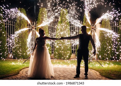 wedding couple dancing on fireworks background