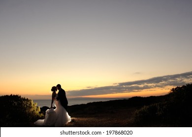 Wedding couple in the evening. Peaceful romantic moment.