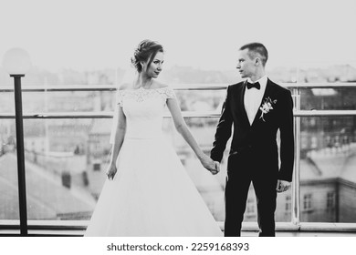 Wedding couple holding hands, groom and bride together on wedding day - Shutterstock ID 2259168393