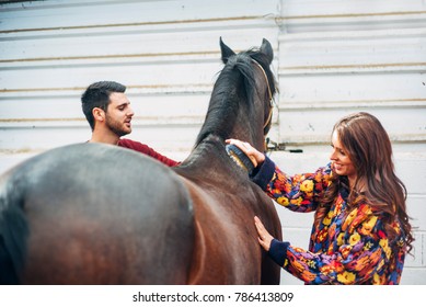 Wedding couple with a horse
