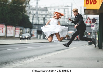 Wedding Couple Jumping In The City