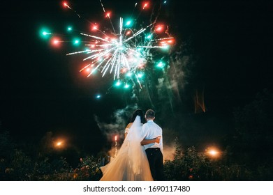 Wedding Couple Are Looking To The Fireworks