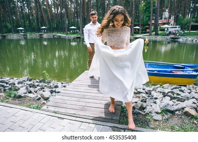 Wedding couple on a boat in the park