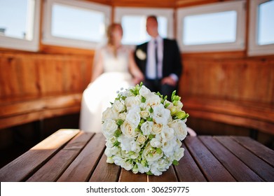 wedding couple on a ship cabin