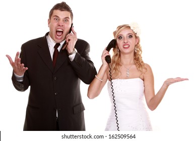 Wedding couple relationship difficulties. Angry woman man talking phone yelling at each other. Portrait fury bride groom. Isolated on white