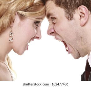 Wedding couple relationship difficulties. Angry woman man yelling at each other. Portrait fury bride groom. Face to face.