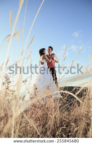 Similar – Image, Stock Photo Couple kissing on the field