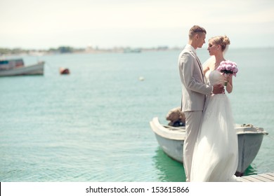 wedding couple together by the sea