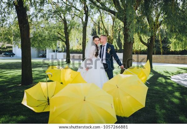 Wedding Couple Umbrella Kissing Near Decorative Stock Photo Edit