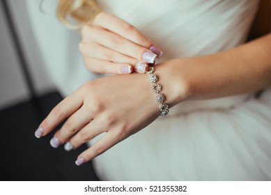 Wedding. Wedding day. Luxury bracelet on the bride's hand close-up Hands of the bride before wedding. Wedding accessories. - Shutterstock ID 521355382