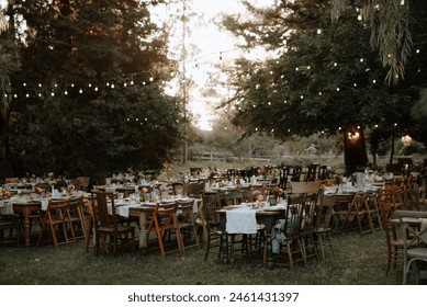 Wedding day reception details of the decorated tables vintage boho themed. - Powered by Shutterstock