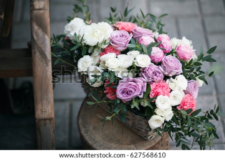 Wedding decor. beautiful flower composition of fresh flowers. concept of a festive dinner, outdoor. rustic style