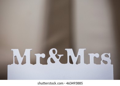 Wedding. Wedding Decor. White Wooden Plaque With The Inscription Mr & Mrs. Wedding Decorations. Mr And Mrs On Isolated Background. Wedding Details