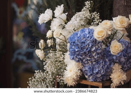 Wedding decorations with flowers. Beautiful decorated ceremony zone, blue flowers. Blue and white flowers in vase. engagement, party, blue hydrangeas and white roses. Florist service. Flowers business