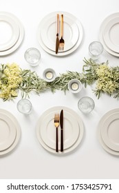 Wedding Dinner Table Setting Decorated With Fresh Flowers And Greenery, Top Down View