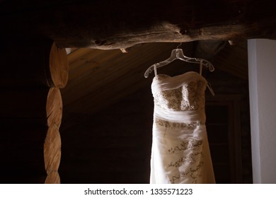 Wedding Dress Hanging In Hanger