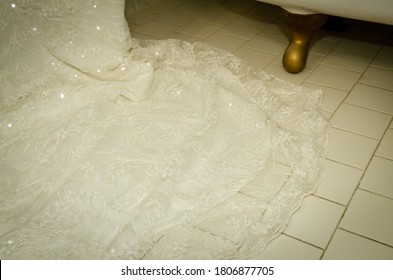 Wedding Dress Hung By Clawfoot Tub