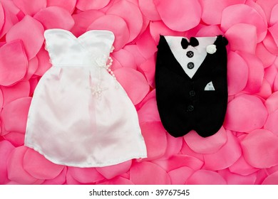 A Wedding Dress And Tuxedo On A Flower Petal Background, Wedding Dress