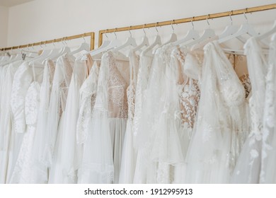 Wedding Dresses On Hangers In A Shop.