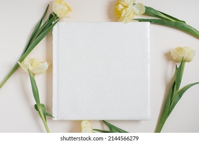 Wedding Or Family Photo Album, Yellow Tulips Flowers On A Light Background; Top View, Flat Lay, Top View