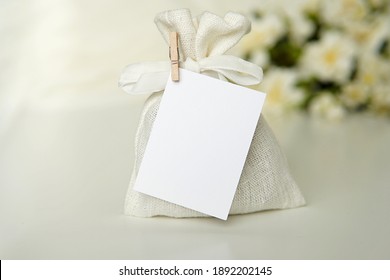 Wedding favor linen bag and tag mockup, rectangle thank you card with wooden clip for wedding, bridal shower.	 - Shutterstock ID 1892202145