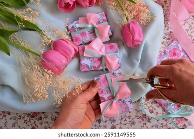 Wedding favors guest gift box soap making woman hands holding scissors pink green ribbon bow tulips background spring summer event decoration, diy craftingparty souvenirs