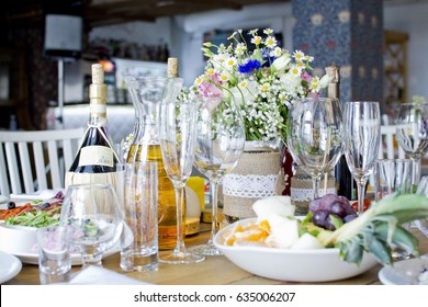 Wedding festive interior, table decorations, flowers, table setting, wine glass, pastel summer tones