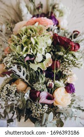 Wedding Floristry. A Bouquet Of Flowers And Greenery Lies On A Granite Window Sill