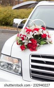 Wedding flowers attached to the car hood 
