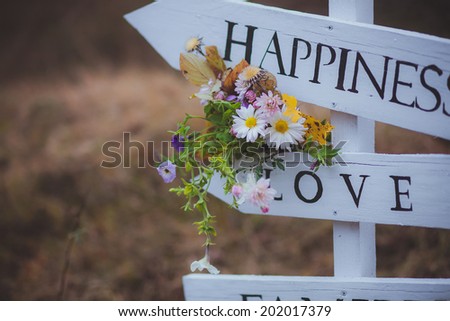 wedding flowers on arrows love happiness