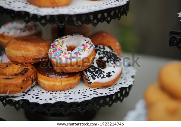 Wedding Foods Donuts Treat Table Dessert Stand at\
Catered Wedding Event